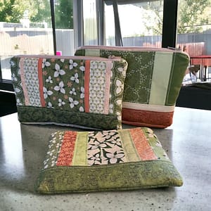 patchwork zippered pouches in green, orange and white